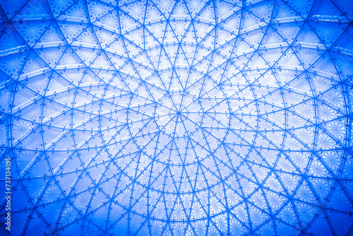 Glass ceiling in blue sky sunlight  abstract. Glass roof of the building.