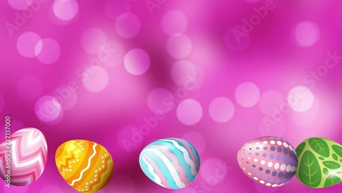 Multicolored Easter eggs rolling on a pink color bokeh background. Loop animation. Easter Bunney animation on pink bokeh photo