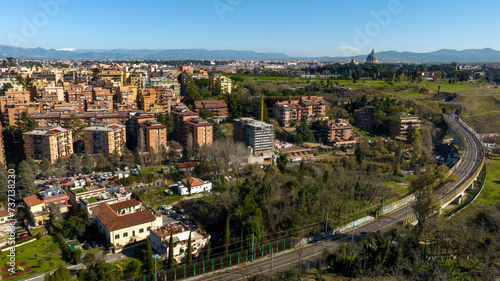 Aerial view of the Balduina neighborhood in Rome, Italy. In the background the dome of St. Peter's Basilica in Vatican City. In the foreground Monte Ciocci and Ettore Scola park.