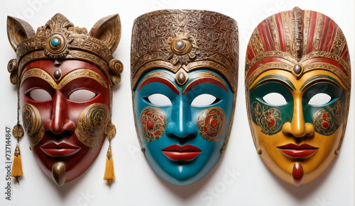 Traditional carved painted wooden masks isolated on white background