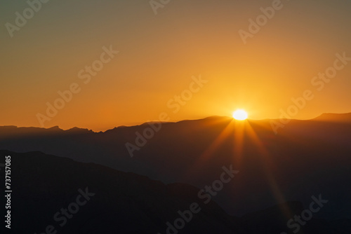 Sunset over Al Hajar Mountains, Jebel Shams, Balcony Walk trial, Oman, Ad Dakhiliyah Governorate © Tommy Lee Walker