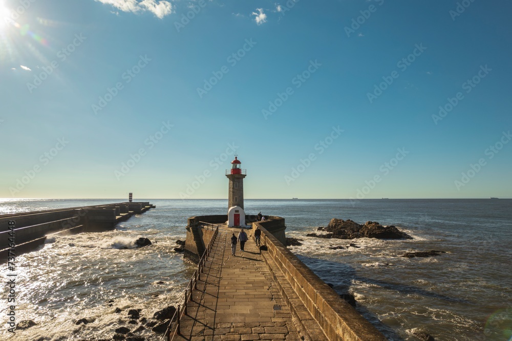 Beacon of the Ocean: A Majestic Lighthouse Illuminating Foz Do Douros Pier and Ocean