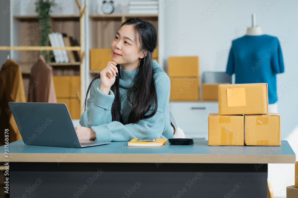 Woman start up small business owner at workplace. small business entrepreneur SME or freelance asian woman working with box at home.. Woman start up small business owner at workplace. small business entrepreneur SME or freelance asian woman working with box at home..