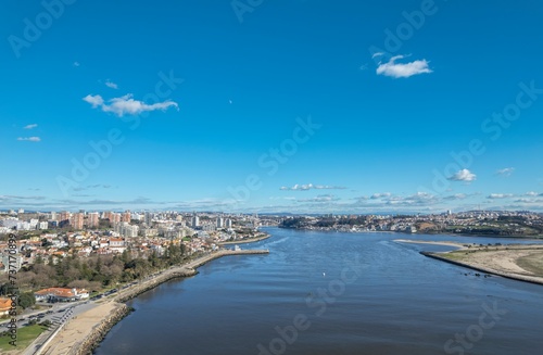 Flowing Serenity: A Mesmerizing Aerial Tapestry of a River Meandering Through a Bustling Cityscape