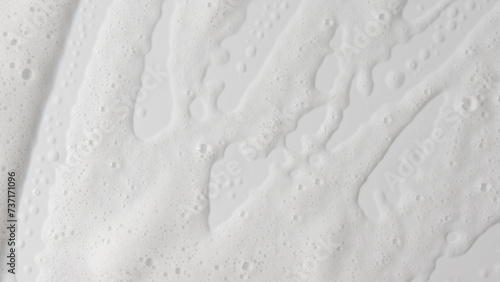 Abstract background white soapy foam texture. Shampoo foam with bubbles