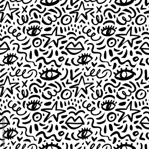 Abstract childish doodle seamless pattern with stars, eyes, squiggles and dots. Scribble grunge brush strokes vector background.