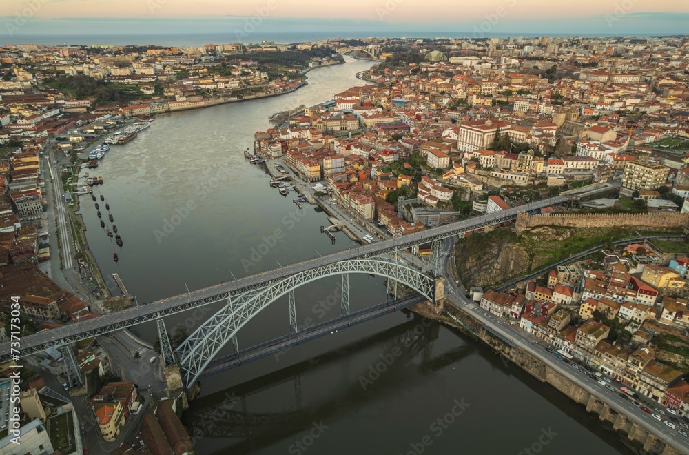 Ethereal Elegance: A Breathtaking Aerial Portrait of Dom Luís I Bridge Spanning Majestic Douro River