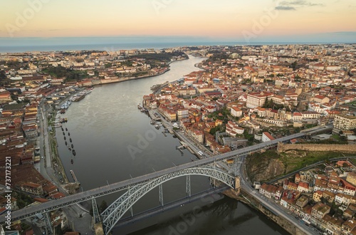 Ethereal Elegance: A Mesmerizing Aerial Glimpse of Dom Lus I Bridge, Gracefully Spanning the Douro River Near Porto. photo