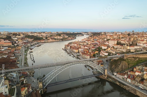 Ethereal Elegance: Masterpiece Bridge by Gustave Eiffel Soaring Over the Majestic Douro River in Porto