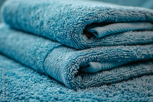 Soft Blue Towels Stacked Neatly.
Close-up of neatly stacked towels.