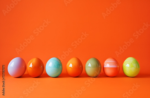 Colorful Easter Eggs Adorned with Floral Patterns on a Vibrant Orange Background