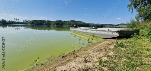 Algal bloom in Hubenov Reservoir rapid increase in the population of algae in a water body. Hubenov Reservoir is a man-made water reservoir, and algal blooms can occur due to various factors such as w