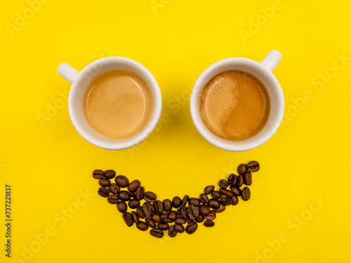 cup of coffee with smile shaped coffee beans