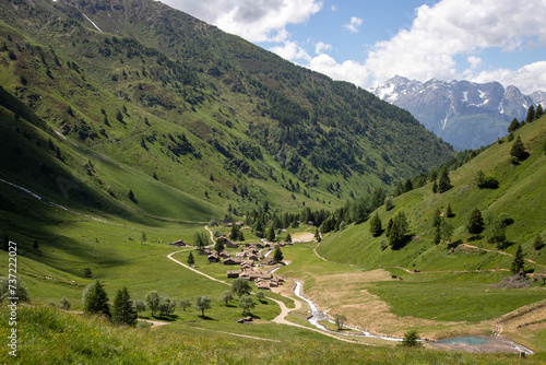 Stone chalets in the beautiful Case di Viso mountain village - Ponte di Legno - Italy photo