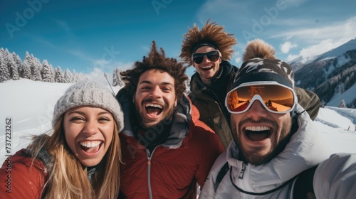 Group of friends having fun in the snow on a sunny day. A group of friends having a great time wearing ski outfit looking at the camera in the snow mountain on a ski holiday