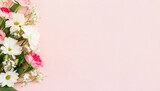 Beautiful spring flowers on light pink background. Top view
