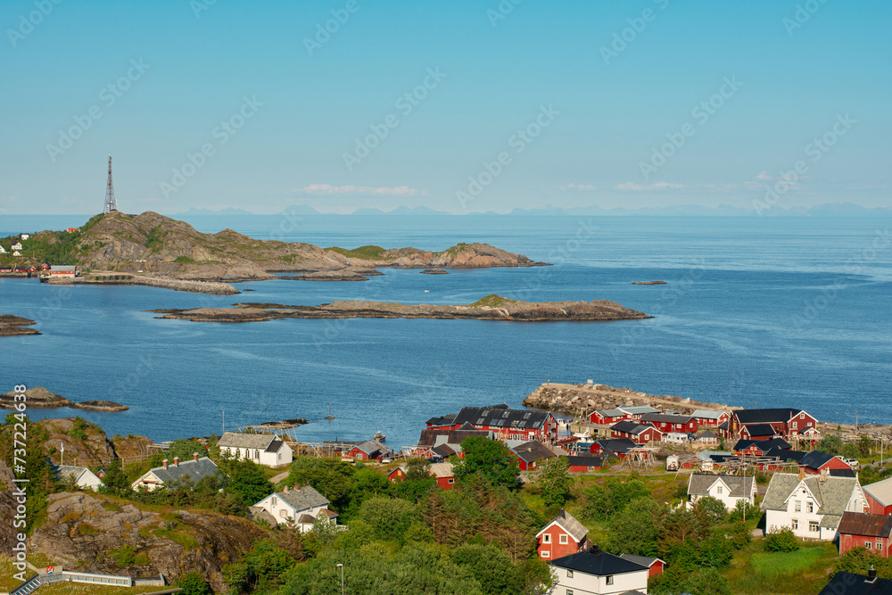 Fototapeta premium View of traditional Lofoten village Å i Lofoten with red fisherman's cabins rorbu, sea and mountains on Moskenesøya island, Lofoten islands, Nordland, Norway. Travel Scandinavian background