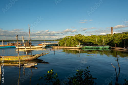 Canoes docked on a mighty river. photo