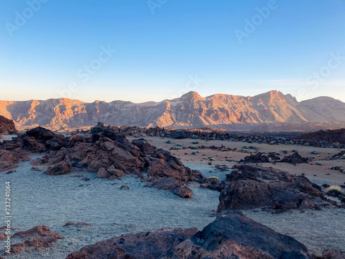 Scenery in El Teide crater on Tenerife. Dry volcanic orange and red landscape during sunset