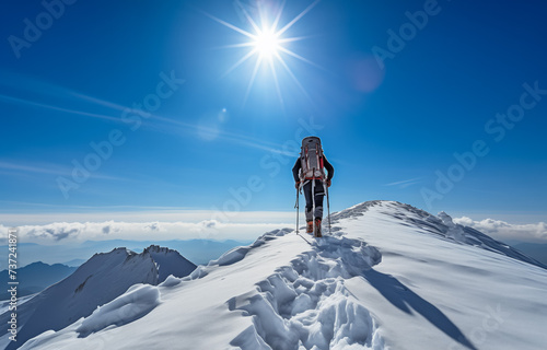 Lone mountaineer trekking the snowy peaks under bright sun