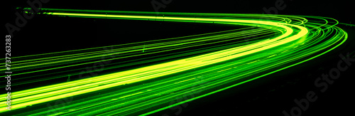 green car lights at night. long exposure