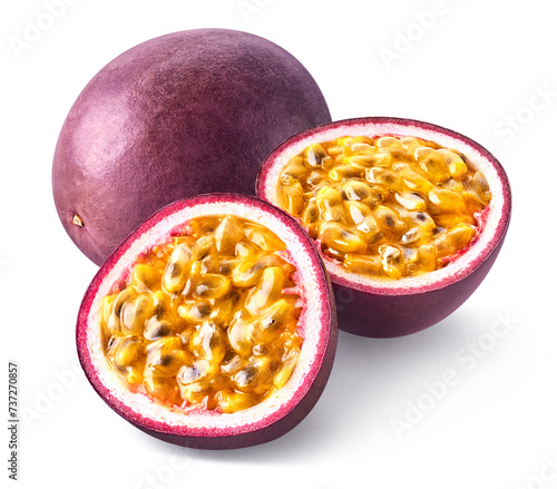 One whole and two halves of fresh passion fruit isolated on white background
