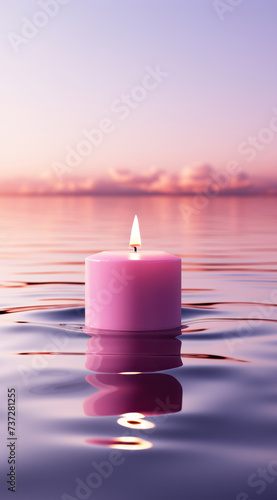 A flaming candle floating on the purple river photo