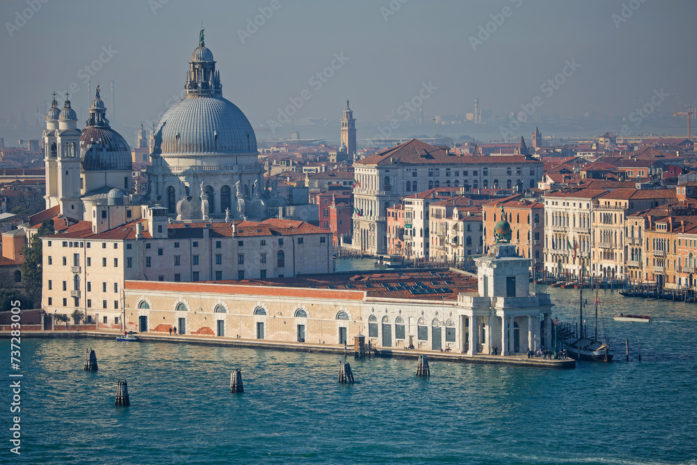 Punta della Dogana and Basilica Santa Maria della Salute at the entrance of Grand Canal in Venice, as seen from San Giorgio Maggiore