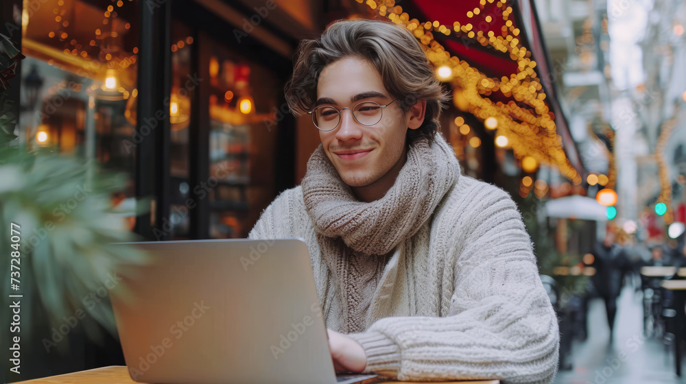 Cheerful young man with glasses working on laptop in festive cafe, urban winter charm. Generative AI Cheerful young man with glasses working on laptop in festive cafe, urban winter charm. Generative AI