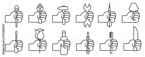Hands holding things in a thin line. Various objects in human hands. Hand with objects vector set.