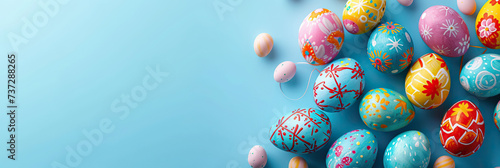 Colorful  patterned eggs float against a blue backdrop  symbolizing the Easter celebration with art and tradition. Vibrant  festive  and perfect for the spring season. Easter concept. Banner.