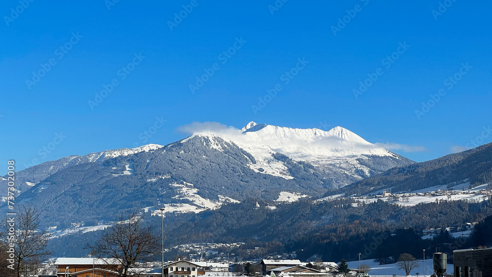 Scenic view of a snow-capped mountain peak, Austria. A winter wonderland in the Austrian Alps. Holidays for Christmas. Mountain landscape. Mobile photo.