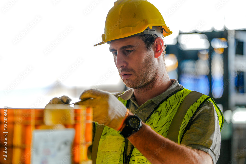 © ultramansk - Men are inspecting steel parts for machine installation. worker cooperate while doing quality control of manufactured.