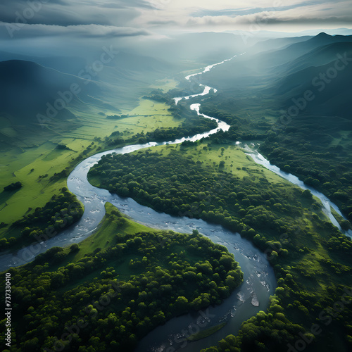 Aerial view of a winding river through lush landscapes. © Cao