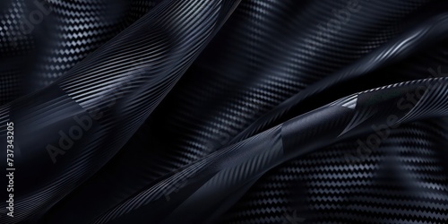 Close-up modern abstract design featuring dark carbon fiber texture.