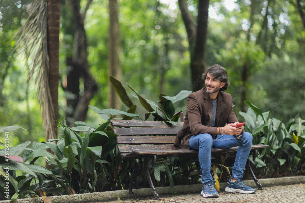 Fototapeta premium View of a young man with smartphone