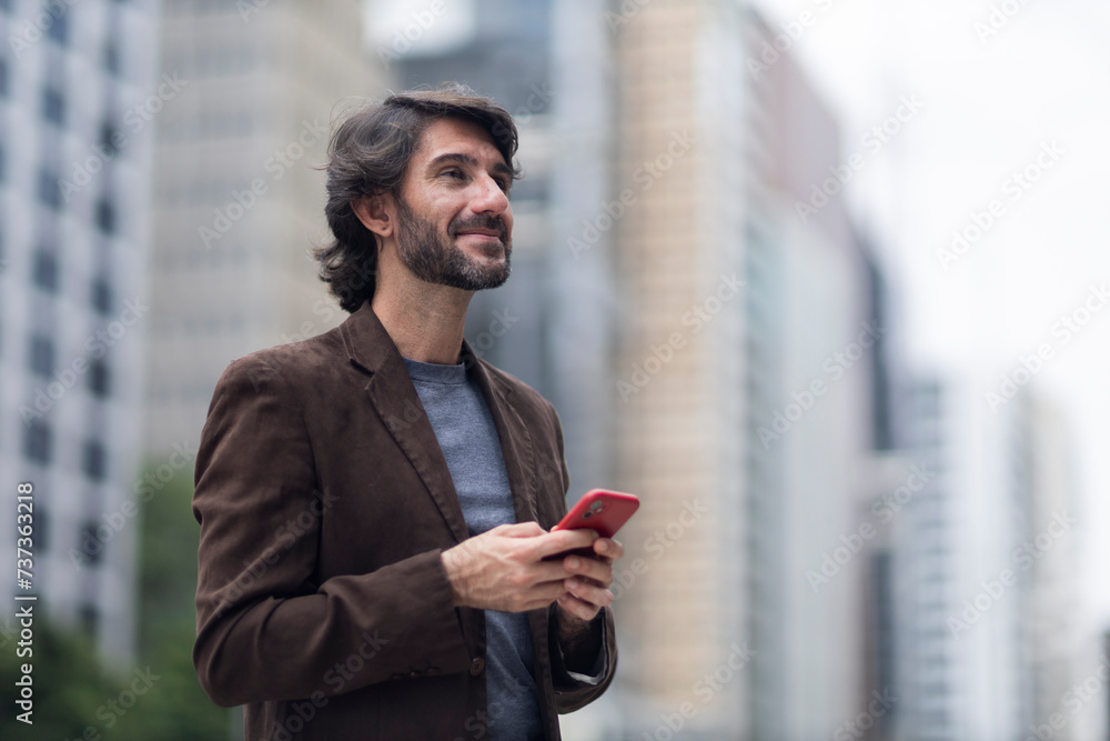View of a young man with smartphone View of a young man with smartphone
