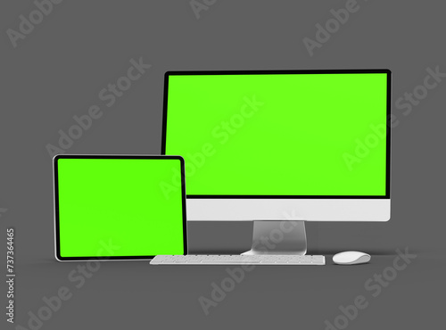 3D Render of desktop and tablet with green screens on a dark background