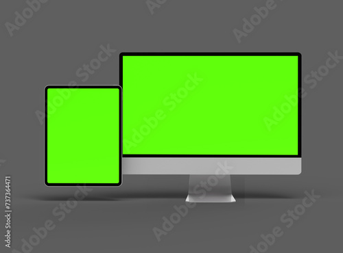 3D Render of desktop and tablet with green screens on a dark background