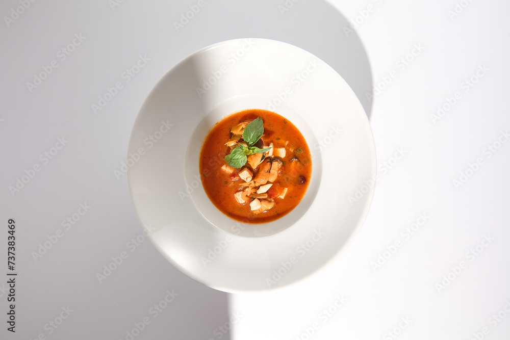 Elevated View of Classic Italian Tomato Seafood Soup with Basil, Ideal for Culinary Websites and Menu Designs Elevated View of Classic Italian Tomato Seafood Soup with Basil, Ideal for Culinary Websites and Menu Designs