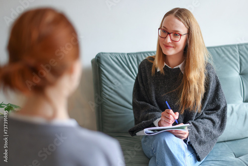 portrait of a psychologist coach in consultation with a client