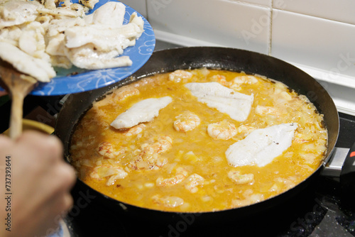 Wallpaper Mural Fish in sauce with shrimp. Step by step preparation. Adding the ingredients Torontodigital.ca