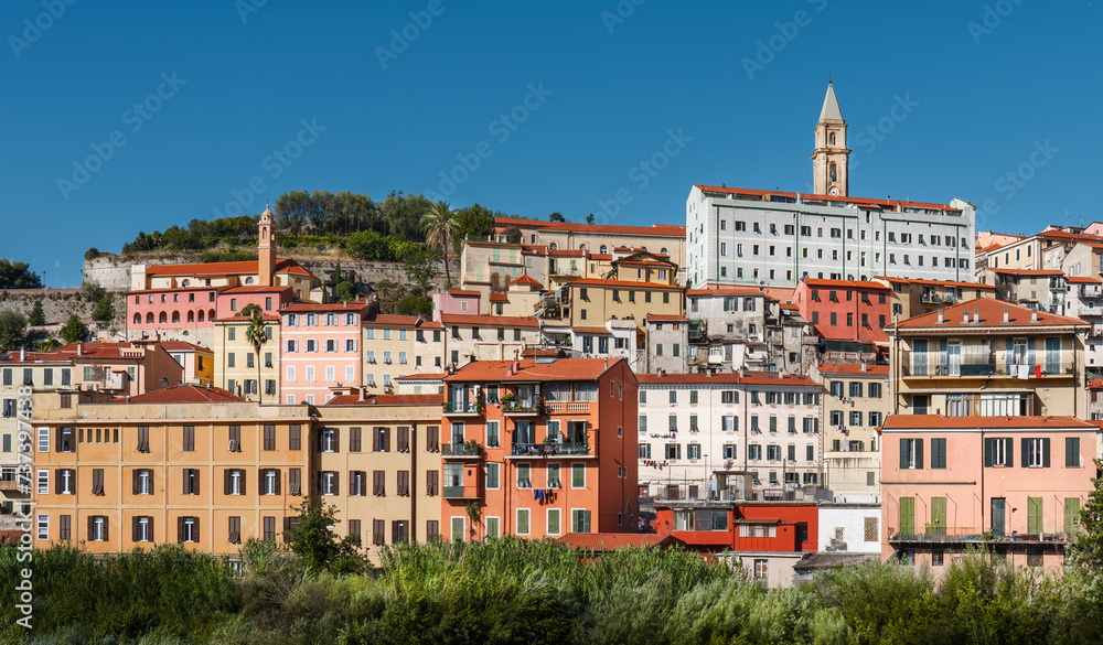 A sunny Mediterranean city on a hill.