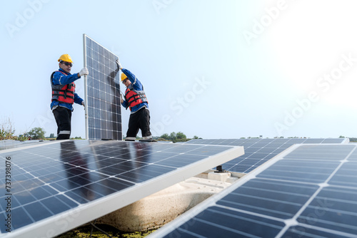 Photovoltaic engineers work on floating photovoltaics. workers Inspect and repair the solar panel equipment floating on water. Engineer working setup Floating solar panels Platform system on the lake.