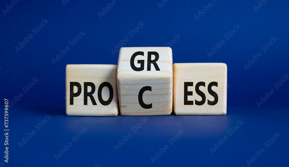 Process and Progress symbol. Wooden cubes with words Process and Progress. Beautiful deep blue background. Business and Process and Progress concept. Copy space Process and Progress symbol. Wooden cubes with words Process and Progress. Beautiful deep blue background. Business and Process and Progress concept. Copy space