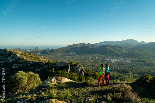 Two women hikers enjoying the beautiful nature from high above, Lliber, Alicante, Costa Blanca, Spain - stock photo © Amaiquez