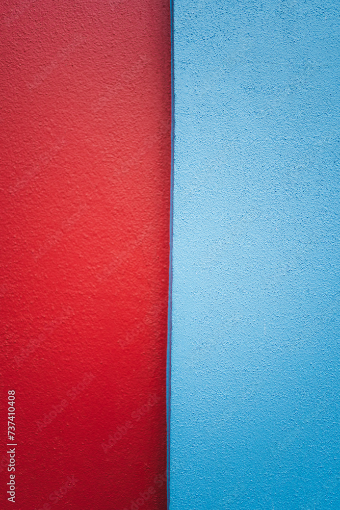 Fototapeta premium Red and blue painting on a house facade in San Cristobal de las Casas, Mexico