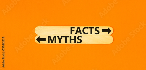 Facts or myths symbol. Concept word Myths and Facts on beautiful wooden stick. Beautiful orange table orange background. Business and facts or myths fact myth concept. Copy space. photo