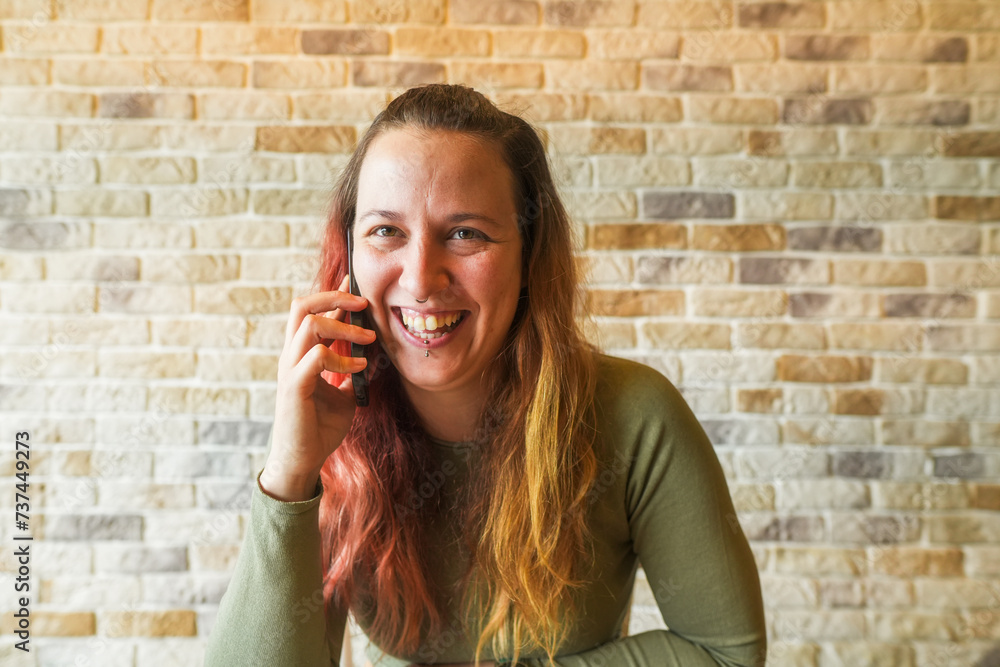 Joyful woman talking on a smartphone Joyful woman talking on a smartphone
