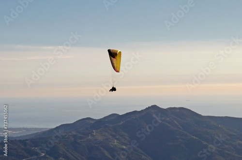 Tandem paraglider flying from Otivar, Spain photo